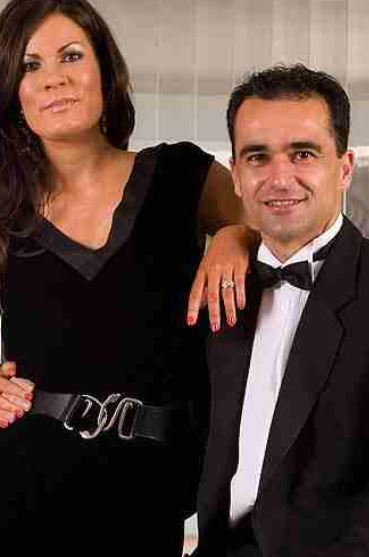 Beth Thompson with partner Roberto Martinez in black attire